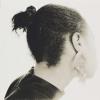 The sixth gelatin silver photograph on paper in Joy Gregory's 'Autoportrait II' series depicting the side view of the back of a womans head