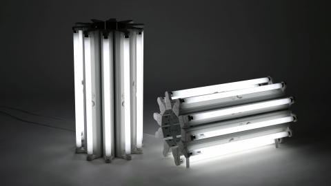 An installation view of a sculptural work made with fluorescent light tubes