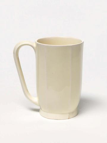 Artwork Mug this artwork made of Earthenware, white clay, slip-cast with ridges and cream glaze, created in 1930-01-01
