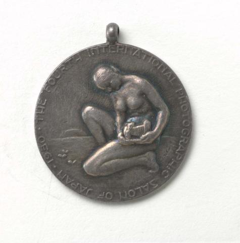 Artwork Fourth International Photographic Salon of Japan 1930.  Silver medallion presented to William Robson this artwork made of Metal