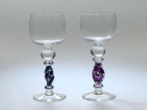 Artwork Two goblets this artwork made of Hot-worked clear glass with spherical bowl and prominent bulbous knop above linked purple and clear twist stem and blue and green double twist stem, created in 1983-01-01