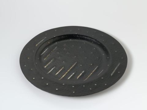 Artwork Slumped platter this artwork made of Black slumped glass large circular platter with gold and silver foil incisions, created in 1984-01-01