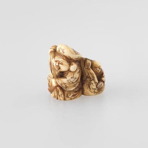 Artwork Netsuke:  (Daikoku (one of the seven dieties of good fortune) carrying a child in his bundle) this artwork made of Carved ivory, created in 1800-01-01