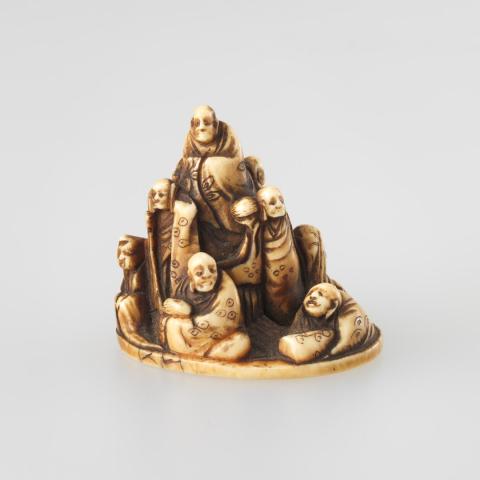 Artwork Netsuke:  (the nine immortals) this artwork made of Carved ivory with flat base, created in 1800-01-01