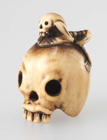 Artwork Netsuke:  (skull with apparition) this artwork made of Carved ivory