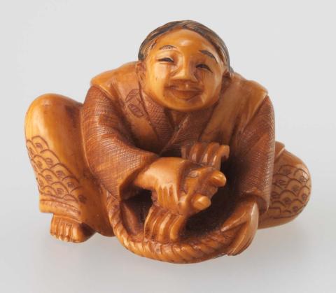 Artwork Netsuke:  (vendor with a crab) this artwork made of Carved ivory, created in 1750-01-01