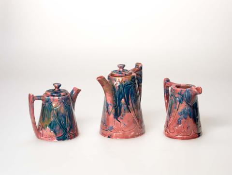 Artwork Coffee set this artwork made of Earthenware, hand-built tapering cylindrical shape with applied handle and spout. Carved decoration with pink glaze splashed sepia and blue, created in 1929-01-01
