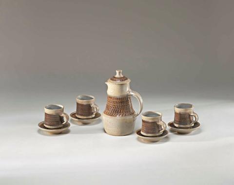 Artwork Coffeepot and four cups and saucers this artwork made of Stoneware, thrown waisted forms with chattered band brushed manganese and salt glazed, created in 1962-01-01