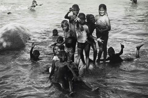 Artwork Kids wading, Yarrabah, NQ (from 'Journeys north' portfolio) this artwork made of Gelatin silver photograph on paper, created in 1986-01-01