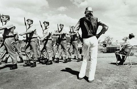 Artwork March past, Toowoomba (from 'Journeys north' portfolio) this artwork made of Gelatin silver photograph on paper, created in 1986-01-01