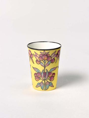 Artwork Beaker this artwork made of China painting on bone china blank in magenta, yellow and blue outlined background and yellow ground.  Black rim