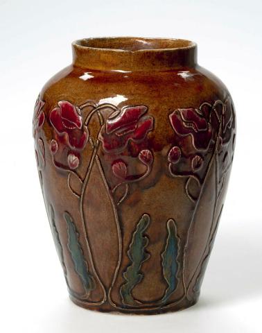 Artwork Poppy vase this artwork made of Earthenware, press-moulded baluster vase carved with poppies.  Sepia ground glaze with green and red poppies, created in 1921-01-01