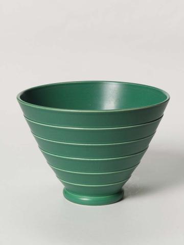Artwork Flaring bowl this artwork made of Earthenware, thrown, flaring shape with engine turned exterior, with deep green glaze