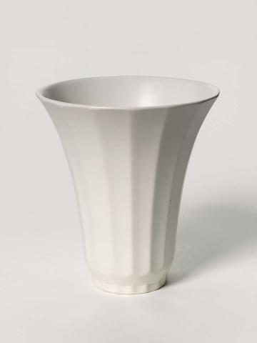 Artwork Fluted vase this artwork made of Earthenware, slip-cast, flaring fluted shape with moonstone glaze