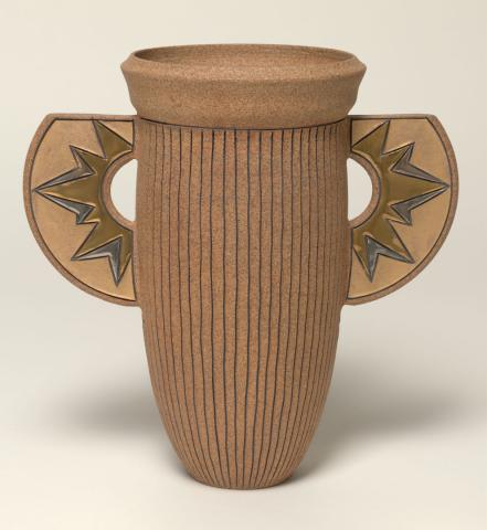 Artwork Winged vase:  Sunburst this artwork made of Reddish buff stoneware clay, wheelthrown in tall calyx shape incised with lines. The lugs with silver and gold details and the interior glazed brown