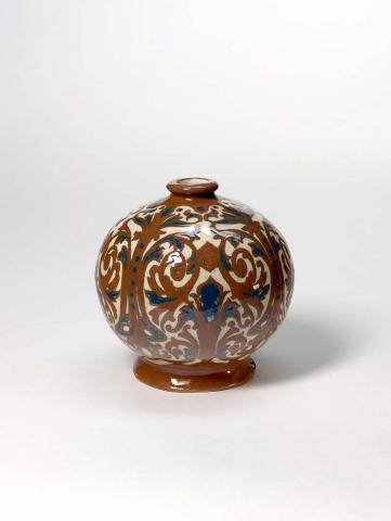 Artwork Spherical vase this artwork made of Hand-built cream earthenware dipped dark red slip and carved with scrolls in the neo renaissance manner.  Cobalt details beneath clear glaze
