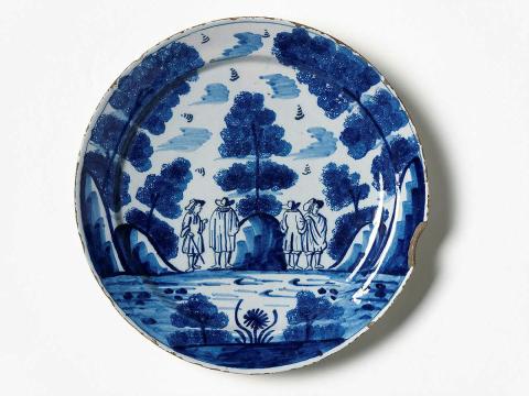 Artwork Dish:  (Four male figures in a landscape) this artwork made of Earthenware, wheelthrown and tin glazed with sponged and brushed cobalt decoration, created in 1650-01-01