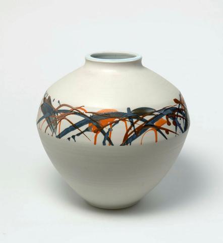 Artwork Sphere this artwork made of Porcelain, wheelthrown with orange, blue and brown trailed glaze over unglazed body.  Interior with blue glaze, created in 1986-01-01
