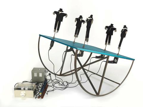 Artwork Field guard (from 'The power tool' series) this artwork made of Anodized aluminium, steel, enamel, electric drills, electric cord, electric plugs, timer, cloth figures and straw, created in 1989-01-01