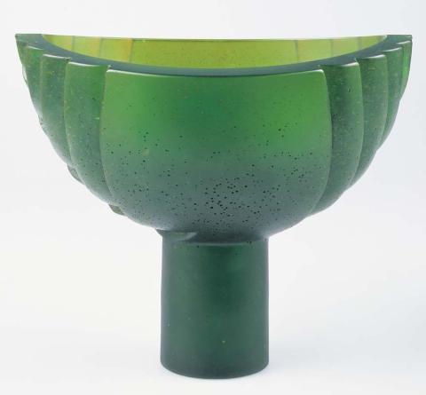 Artwork Vase:  Flax pod 'Te Rito' this artwork made of Dark green lead crystal pate de verre, lost-wax cast, created in 1996-01-01
