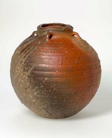 Artwork Pot:  Shigaraki orb no. 2 this artwork made of Stoneware, wheelthrown with gravel inclusions in the clay, vestigial lugs, Anagama fired with ash deposit, created in 1989-01-01