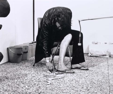 Artwork Tack line (Push tacks into your leg until a line of tacks has been made up your leg) (performance work, Galerie Media, Neuchatel, Switzerland, June 1973, from a series of performances titled 'Wound by measurement') this artwork made of Gelatin silver photograph on paper, created in 1973-01-01