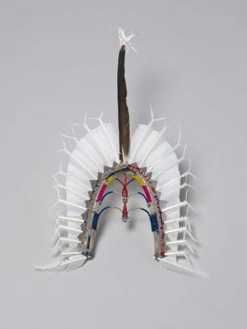Artwork Dari headdress this artwork made of Cane, cotton thread, pearl shell, PVA fixative and sea-bird feathers, created in 2000-01-01
