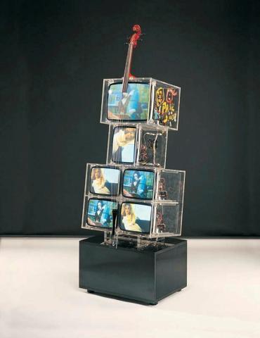 Artwork TV cello this artwork made of DVDs, video monitors, perspex, wooden cello neck with coloured plastic strings and wooden tail piece, marble base, created in 2000-01-01