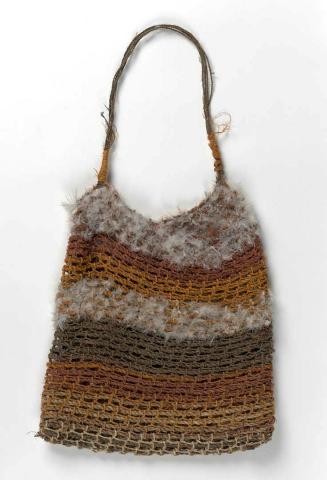 Artwork Jerrk (looped string bag) this artwork made of Looped kurrajong (Brachychiton diversifolus) fibre with natural dyes, brolga feathers and string handle, created in 2001-01-01