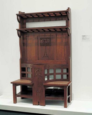 Artwork Hallstand this artwork made of Black bean (Castanospermum australe) assembled and carved with leather seat and copper drip tray, created in 1920-01-01