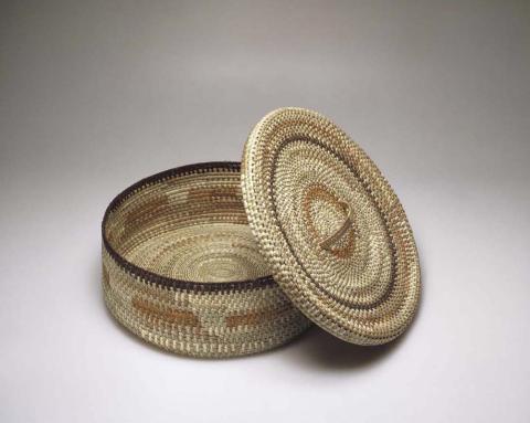Artwork Basket this artwork made of Coil-woven pandanus palm fibre with natural dyes, created in 2002-01-01