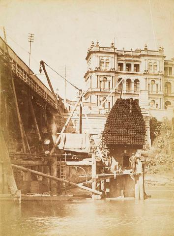 Artwork Airlock - weighted with steel rails.  Pier construction on north bank of River Brisbane (sic) this artwork made of Albumen photograph on paper, created in 1895-01-01