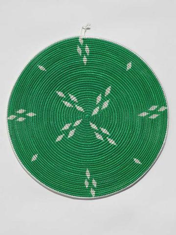 Artwork Round mat this artwork made of Woven raffia over coconut midrib, created in 2003-01-01