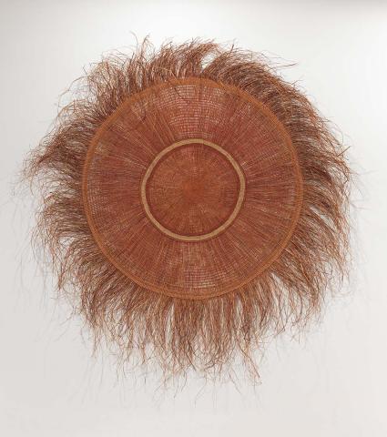 Artwork Circular mat this artwork made of Twined pandanus palm leaf, natural dyes