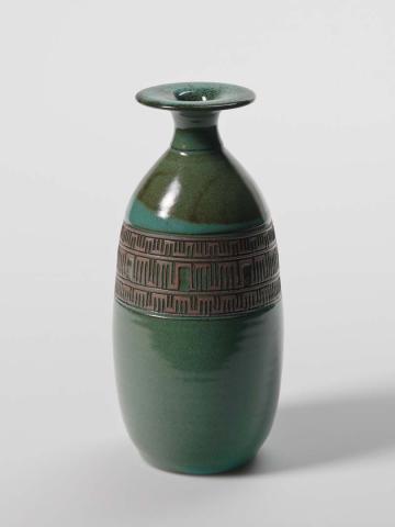 Artwork Vase with flared lip this artwork made of Earthenware, wheelthrown with hand-carved band at the shoulder and green glaze, created in 1980-01-01