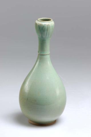 Artwork Bottle this artwork made of Elongated stoneware pear-shaped bottle with single ridge around base of neck, and bulb-shaped neck in the form of a lotus bud; celadon glaze