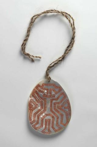 Artwork Riji (pearlshell pendant): Man/Beast Ilyarrgan/Jawi this artwork made of Pearlshell, hair string with natural pigment, created in 2006-01-01