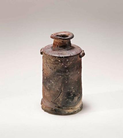 Artwork Lugged bottle this artwork made of Stoneware, wheelthrown with granulated feldspar, combed marks with stone explosions and natural ash glaze
