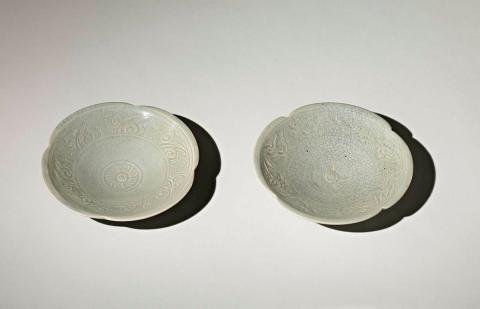 Artwork Pair of dishes this artwork made of Porcelain, wheelthrown with notched lip and carved with foliate motifs beneath a crazed celadon glaze