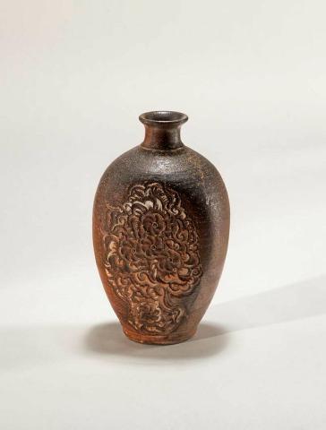 Artwork Small battered bottle this artwork made of Stoneware, wheelthrown with floral decoration carved through white slip and natural ash glaze, created in 1998-01-01