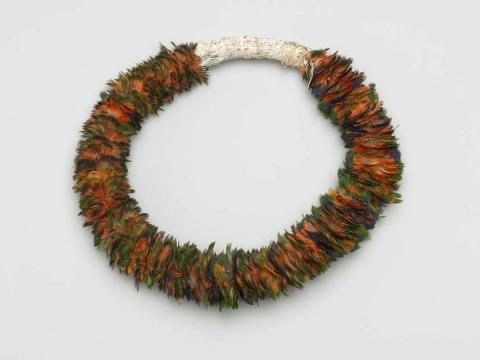 Artwork Ceremonial headband this artwork made of Red-winged parrot feathers, bark fibre string, native bees wax with white clay, created in 1997-01-01