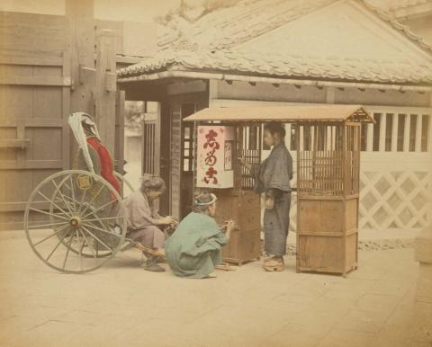 Artwork (Food seller) (from 'Japan' album) this artwork made of Hand-coloured albumen photograph on board (originally bound in an album), created in 1870-01-01