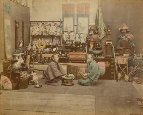 Artwork (Curios shop) (from 'Japan' album) this artwork made of Hand-coloured albumen photograph on board (originally bound in an album), created in 1870-01-01