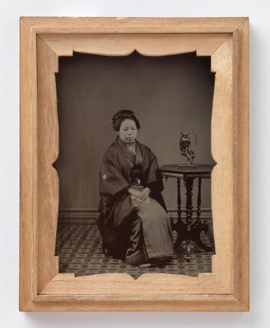 Artwork Portrait of woman with owl figurine on table this artwork made of Ambrotype, created in 1900-01-01