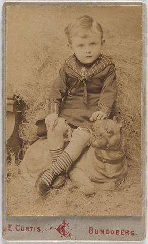 Artwork (Young boy with dog) this artwork made of Albumen photograph on paper mounted on card, created in 1882-01-01