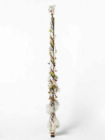 Artwork Banumbirr (Morning Star pole) this artwork made of Wood, bark fibre string, cotton thread, feathers, native beeswax, natural pigments, created in 1995-01-01