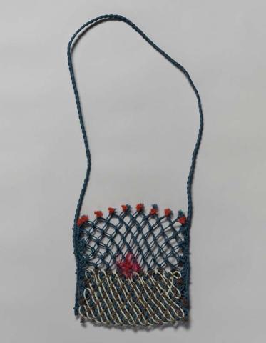 Artwork Ghost net gear bag (red flower) this artwork made of Woven reclaimed acrylic fishing net, created in 2009-01-01