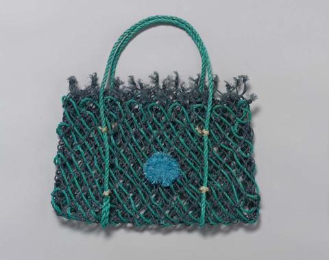 Artwork Ghost net gear bag (blue flower) this artwork made of Woven reclaimed acrylic fishing net, created in 2009-01-01