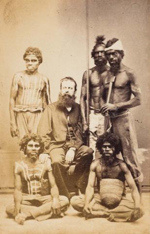 Artwork Dr JF Berini with Queensland Aboriginal men this artwork made of Albumen photograph mounted on card, created in 1869-01-01