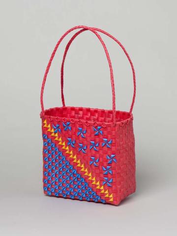 Artwork Basket this artwork made of Woven polypropylene tape (red with blue and yellow designs), created in 2011-01-01